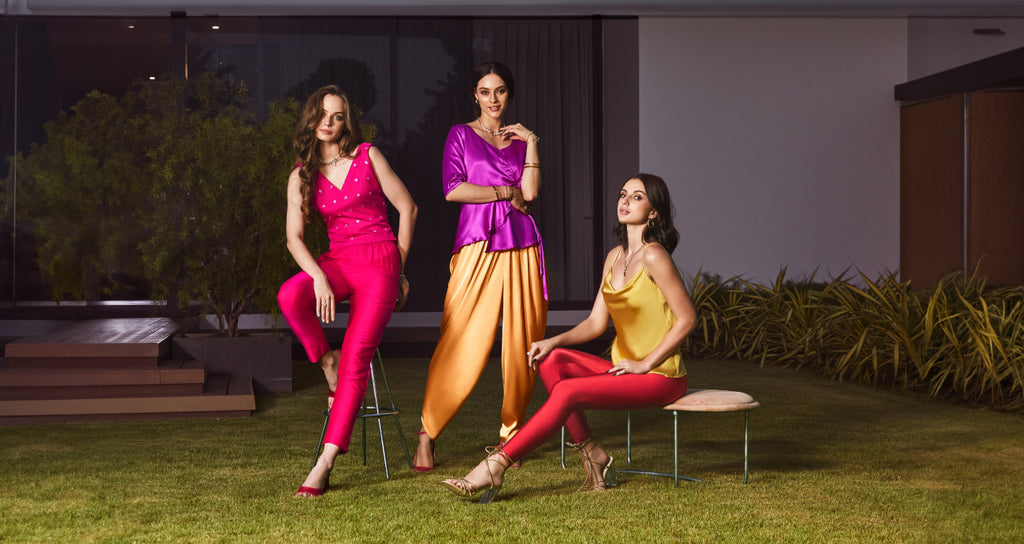 Image of three women posing with Go Colors Ethnic Bottomwear Collection.