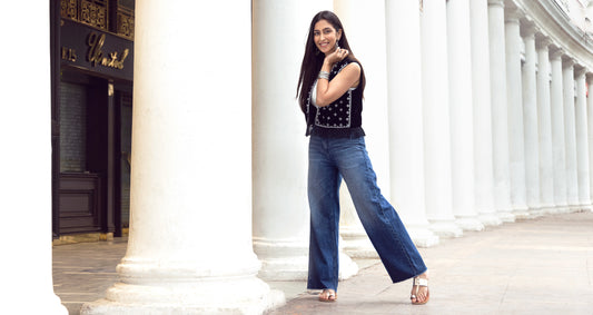 Image of a woman standing and posing in Go Colors Denim