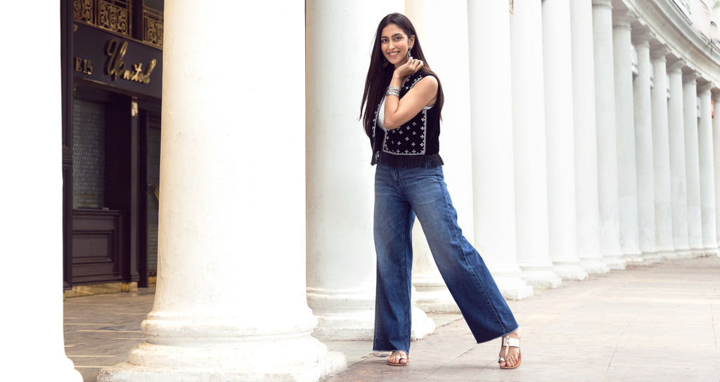 Image of a woman standing and posing in Go Colors Denim